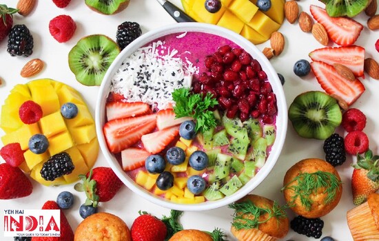 Top with chopped fruits and berries